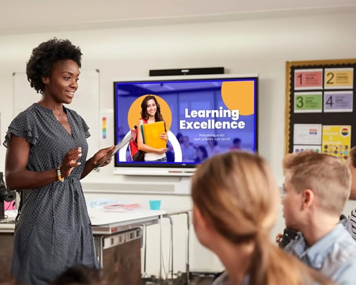 A teacher uses digital signage to enhance student learning