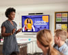 A teacher uses digital signage to enhance student learning