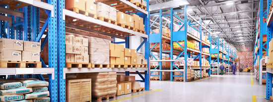 Warehouse with stacked shelves, workers, and a forklift.