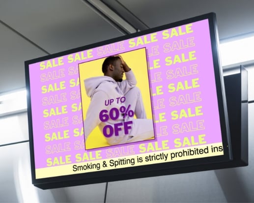 Digital signage screen displaying a bright sale ad with 'Up to 60% Off' and a smoking prohibition message at the bottom.