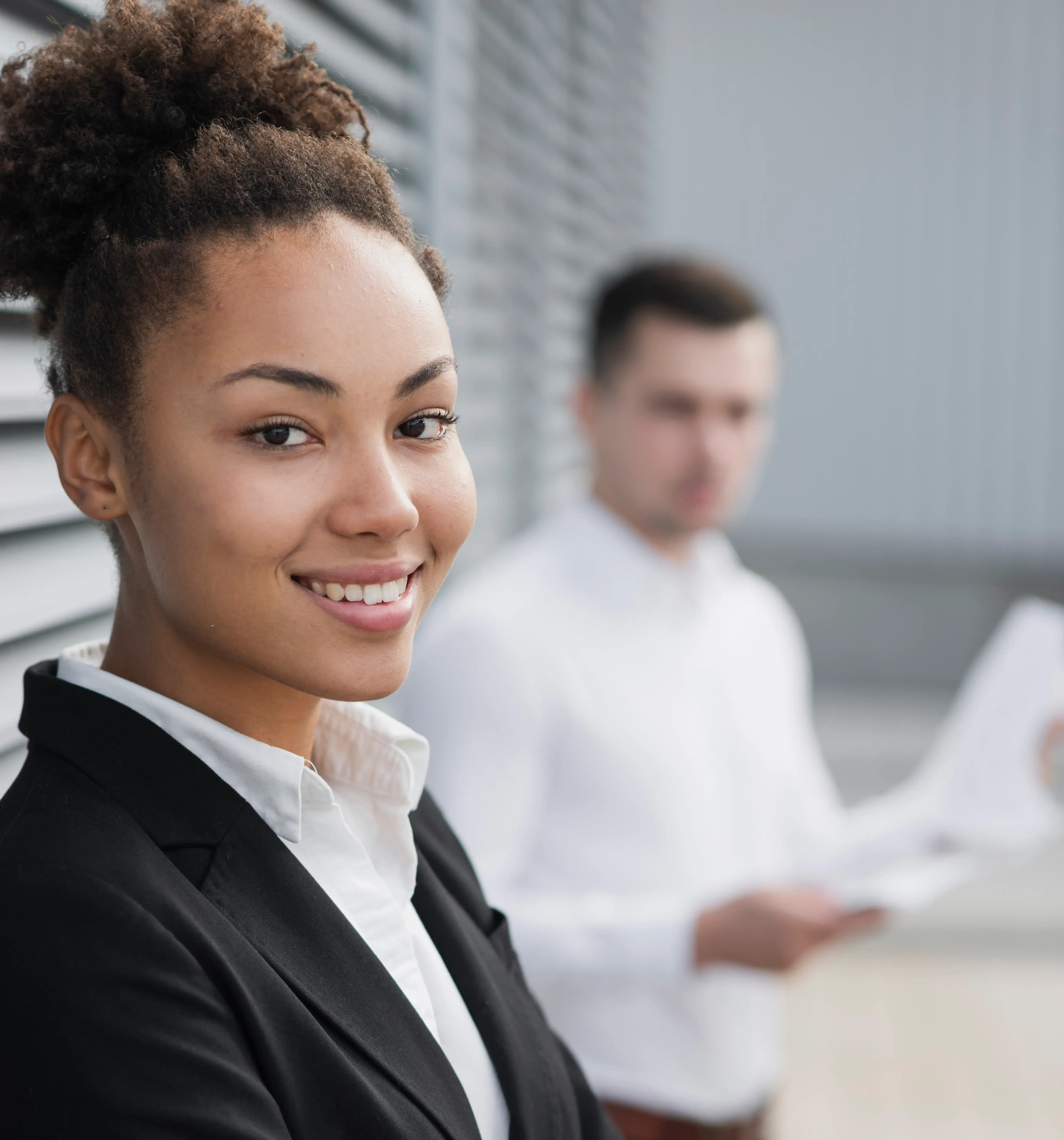 An L Squared support specialist working with a colleague